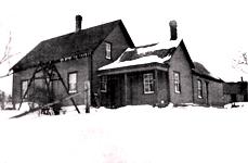 Photograph of a Farm house where James Robert (Jimmie) Swan and Mary Winifred (Mame) Swan lived in Tweedside overlooking Oromocto Lake. The house was eventually enlarged and shared with son Earl and wife Dora.